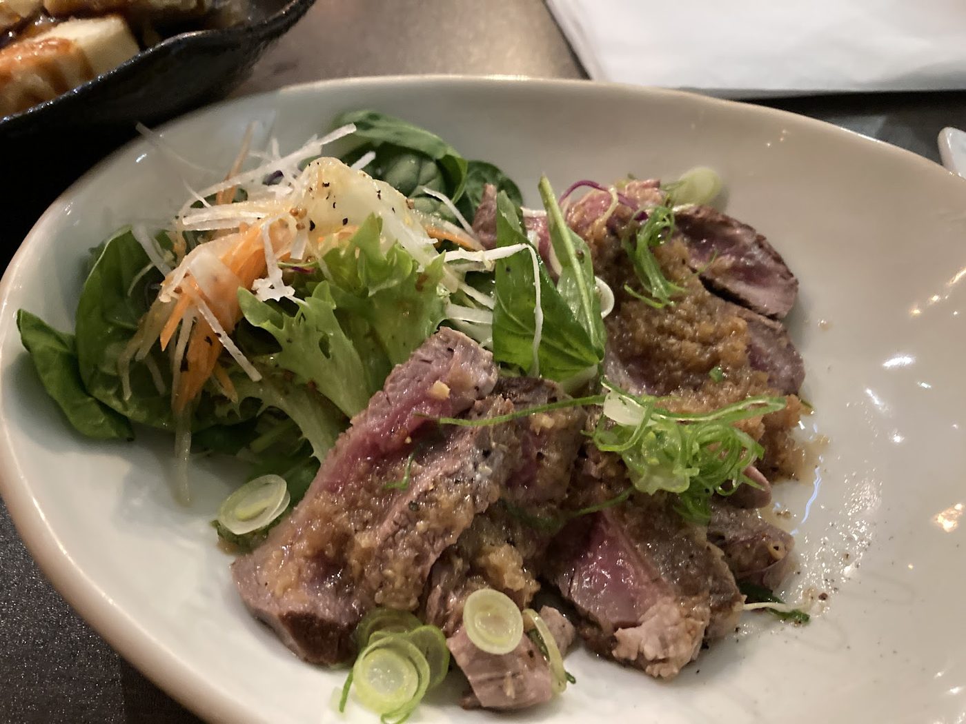 Fuga Japanese-style beef and salad plate with herbs and vegetables